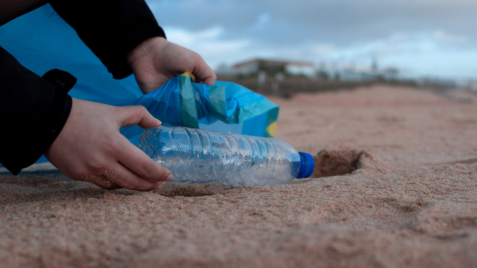 person-holding-clear-plastic-bottle-3480494