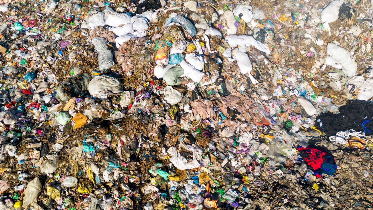 Texture of landfill with burning trash piles